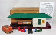 Load image into Gallery viewer, Lionel 356 Operating Freight Station w/ red & green carts boxed and complete